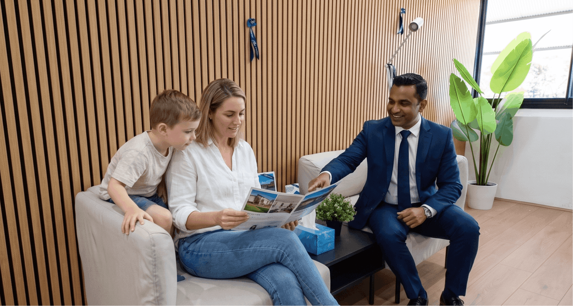 A Blue Ribbon agent going through property listings with a family